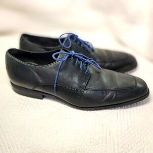 Cole Haan black‎ leather oxfords.